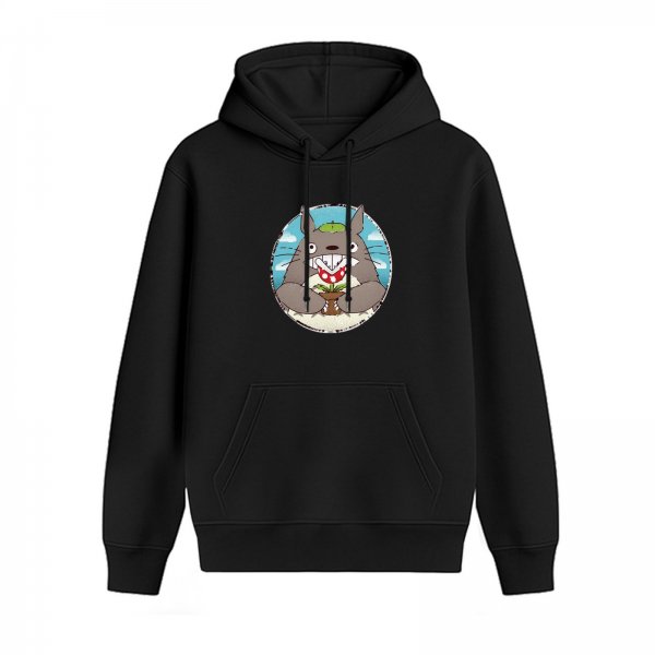 Black hoodie with Totoro graphic holding a small plant