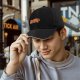 Black baseball cap with a sleeping red panda graphic