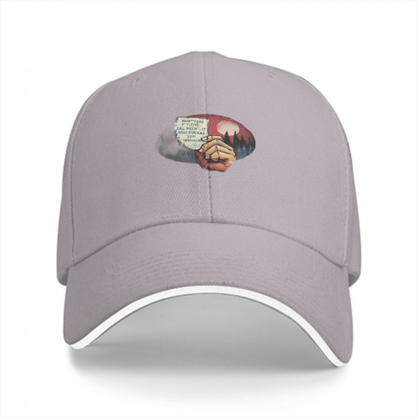 Black baseball cap with hand holding paper over red moon forest print