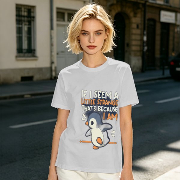 Olive t-shirt with 'If I seem a little strange that's because I am' penguin print