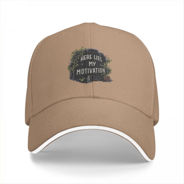 Black baseball cap with 'Here Lies My Motivation' tombstone graphic