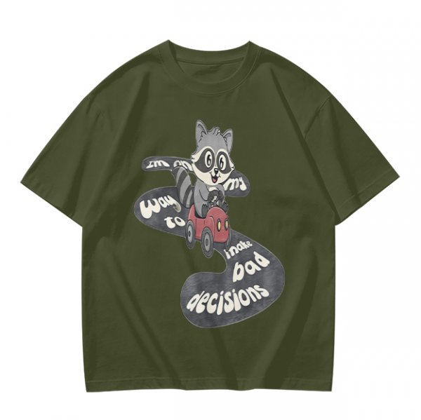 Olive graphic tee with raccoon driving car and 'Way to make bad decisions' text