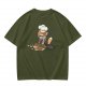 Olive T-shirt with a stressed cartoon cat baking cookies