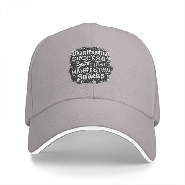 Black baseball cap with 'I'm manifesting snacks' text print