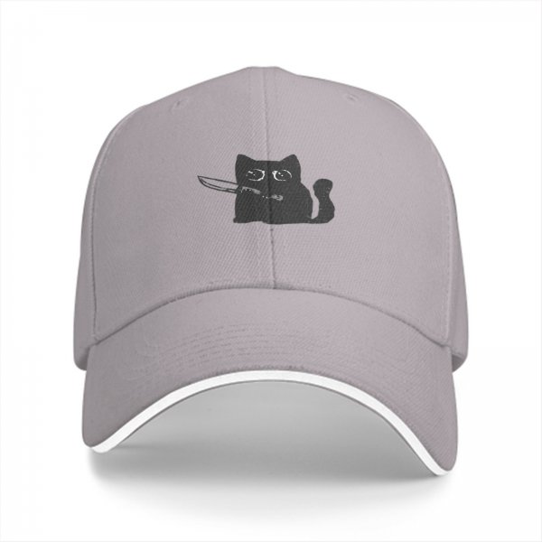 Black baseball cap with a cartoon cat holding a knife graphic