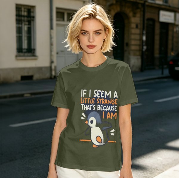 Olive t-shirt with 'If I seem a little strange that's because I am' penguin print