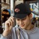 Black baseball cap with cute fantasy creature graphic print