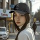 Black baseball cap with spooky pumpkin figure and 'Always Sexy' text