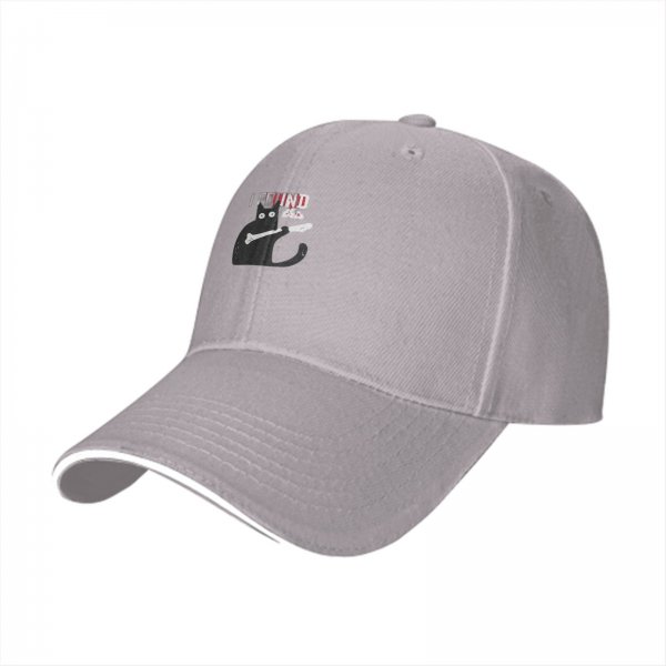 Black baseball cap with a cat holding a bone graphic and text