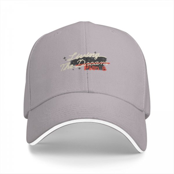 Black baseball cap with 'Living The Dream Plan B' graphic print