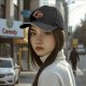 Black baseball cap with cute fantasy creature graphic print