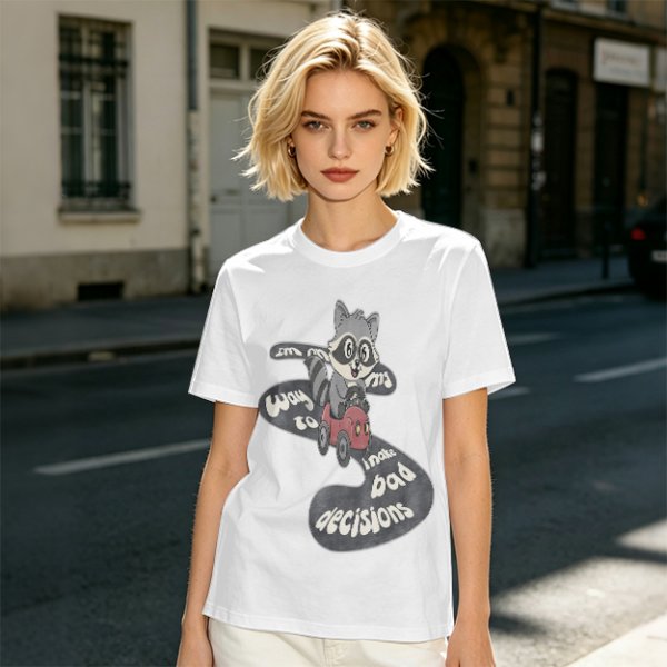 Olive graphic tee with raccoon driving car and 'Way to make bad decisions' text