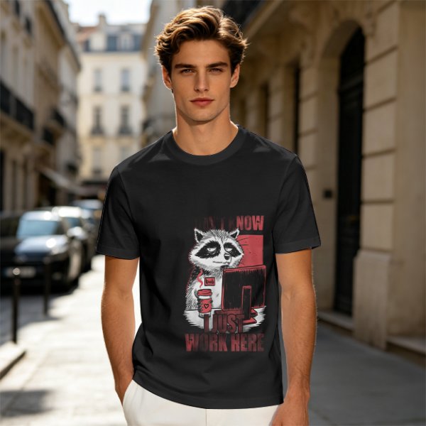 Olive graphic t-shirt with a tired raccoon office worker and 'I Just Work Here' text