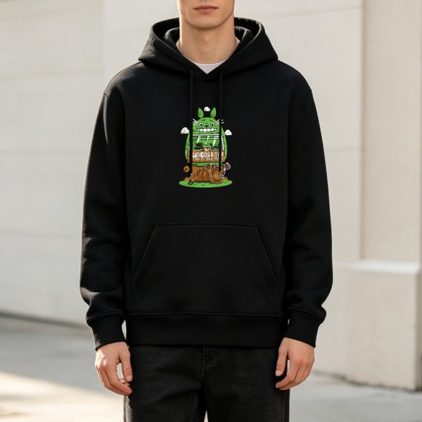 Black hoodie with whimsical green forest creature graphic