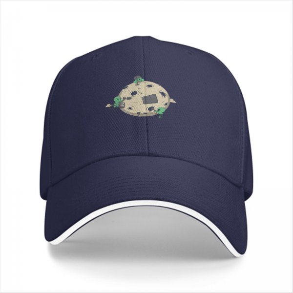 Black baseball cap with aliens repairing a cratered moon design