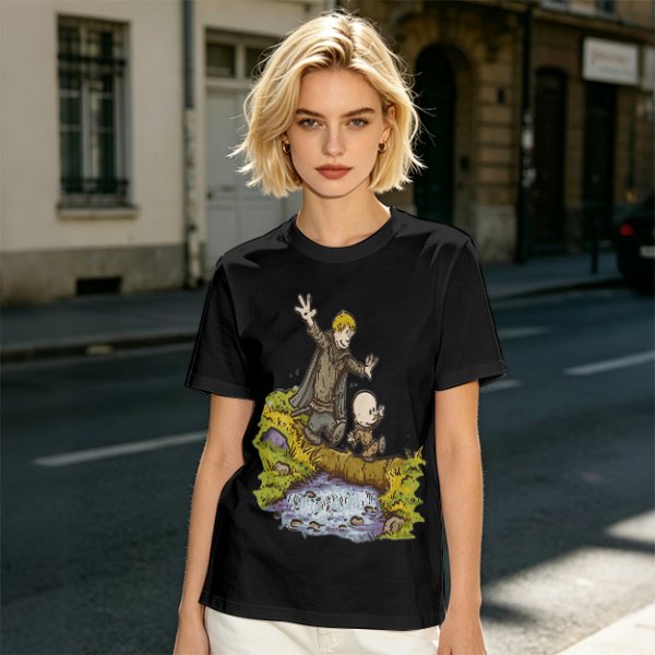 Olive T-shirt with fantasy characters balancing on a log over a stream
