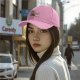 Black baseball cap with playful anthropomorphic coffee cups graphic