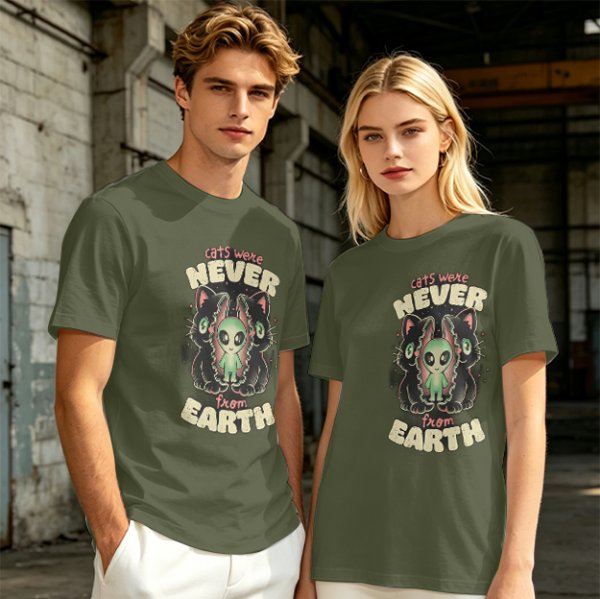 Olive green graphic t-shirt with 'cats were never from earth' alien and cat print