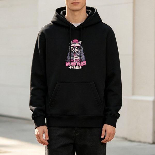 Black hoodie with a weird raccoon graphic and 'Weird Vibes' text