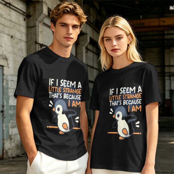 Olive t-shirt with 'If I seem a little strange that's because I am' penguin print