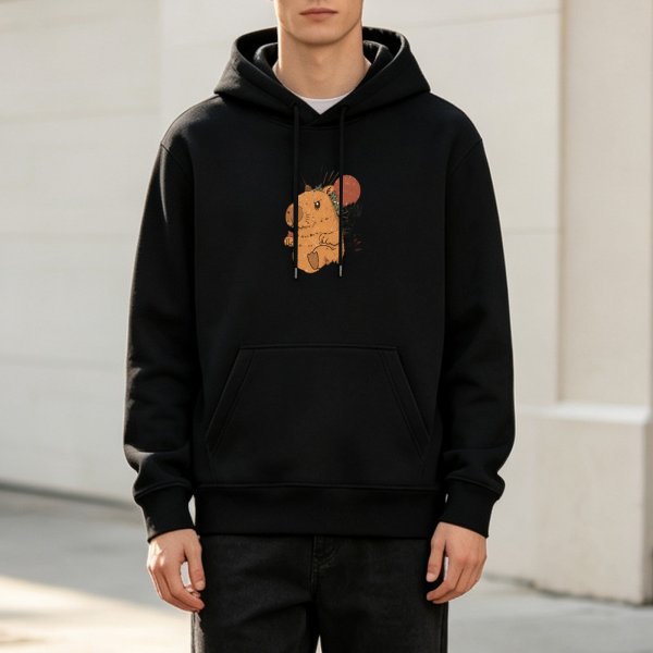 Black hoodie with cute capybara holding orange fruit graphic