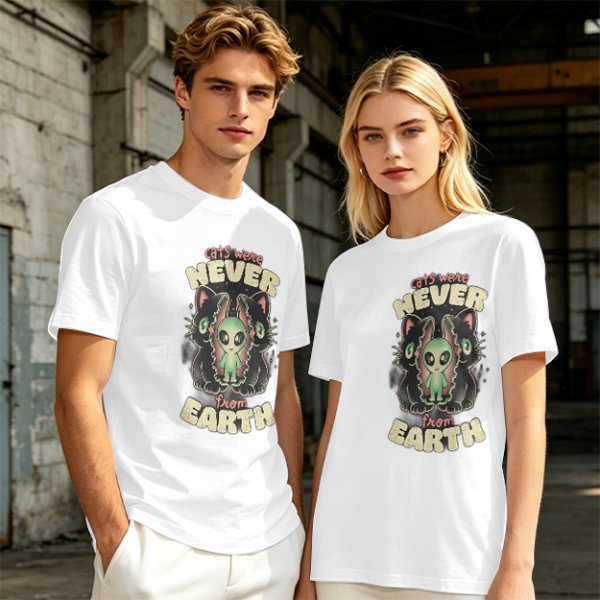 Olive green graphic t-shirt with 'cats were never from earth' alien and cat print