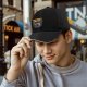 Black baseball cap with Pew Pew Fighters space gun graphic