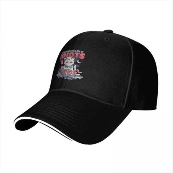 Black baseball cap with sailing cat graphic and 'Sailing in this sea of idiots' text