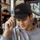 Black baseball cap with retro sunset and dice graphic