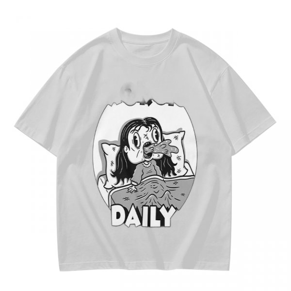 Olive green graphic t-shirt with bedridden cartoon girl and 'DAILY' text