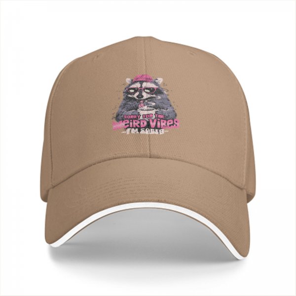 Black baseball cap with raccoon graphic and 'Sorry for the weird vibes I'm sober' text