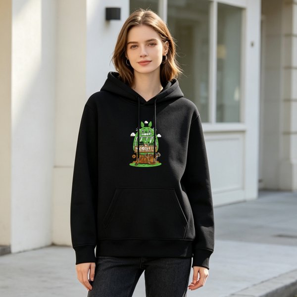 Black hoodie with whimsical green forest creature graphic