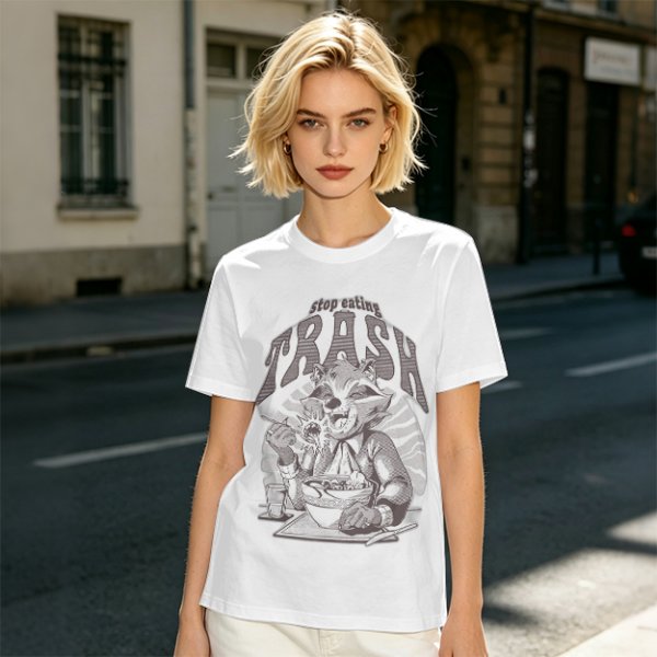 Olive graphic t-shirt with raccoon eating and 'Stop eating TRASH' print