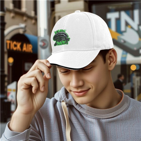 Black baseball cap with alien graphic and 'Kiss Me' text