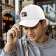 Black baseball cap with raccoon graphic doing the bare minimum