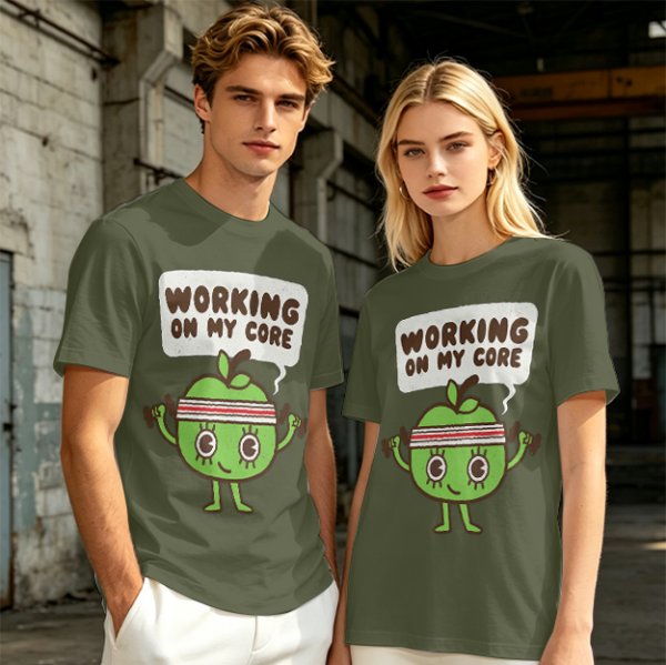 Olive green t-shirt with cartoon apple lifting dumbbells and 'Working on my core' text