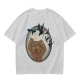 Olive T-shirt with a terrified gingerbread man and flying birds graphic