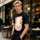 Olive t-shirt with a cartoon dinosaur in a ramen bowl graphic