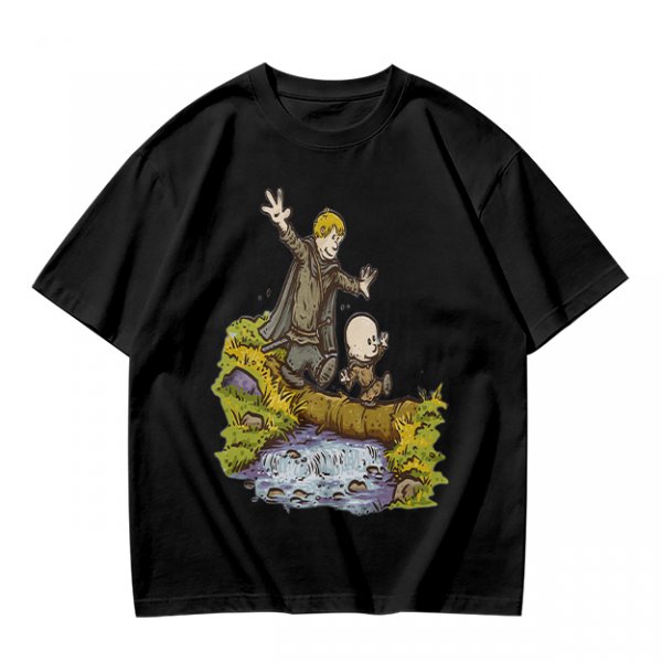 Olive T-shirt with fantasy characters balancing on a log over a stream