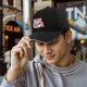 Black baseball cap with cute strawberry milk carton cat graphic