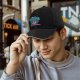 Black baseball cap with 'In My Defense I Was Left Unsupervised' print