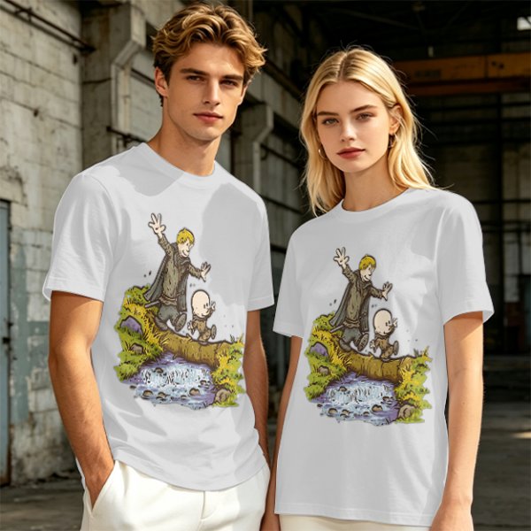 Olive T-shirt with fantasy characters balancing on a log over a stream