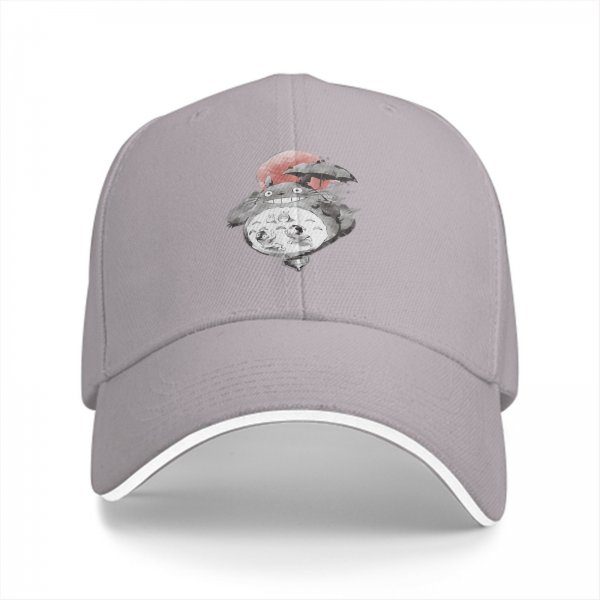 Black baseball cap with Totoro holding umbrella and red sun graphic
