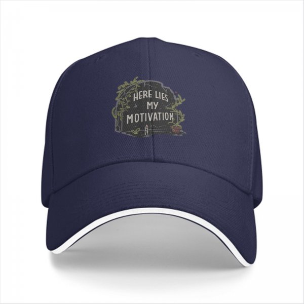 Black baseball cap with 'Here Lies My Motivation' tombstone graphic