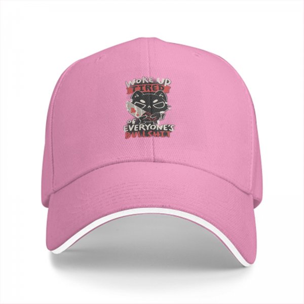 Black baseball cap with a tired cat graphic and humorous text