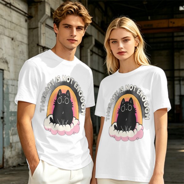 Olive graphic tee with black cat, rainbow, and 'Therapy Is Not Enough' text