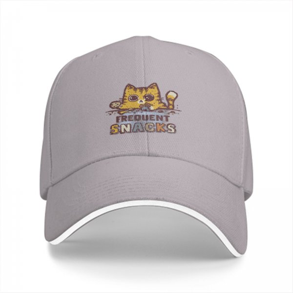 Black baseball cap with a hungry cat graphic and frequent snacks text