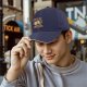 Black baseball cap with funny email cartoon graphic and text