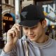 Black baseball cap with stacked cat graphic and 'FREE' text