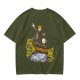 Olive T-shirt with fantasy characters balancing on a log over a stream